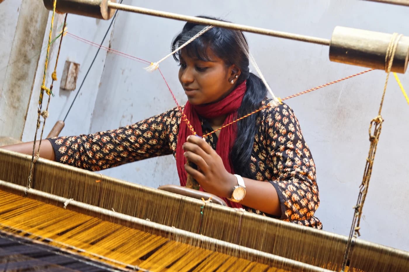 Mridula at a loom during her textile design days